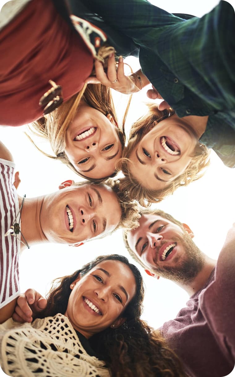 Three people smiling together